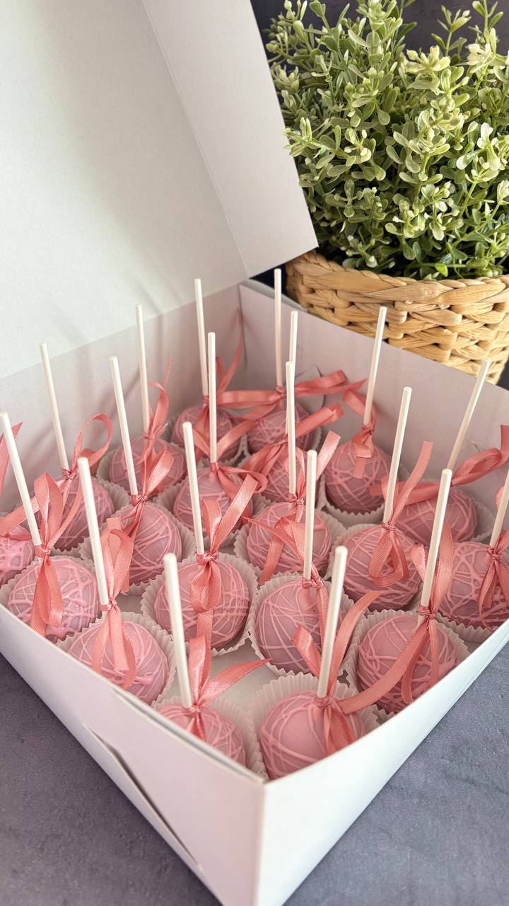 Pink cake pops in a corporate gift box