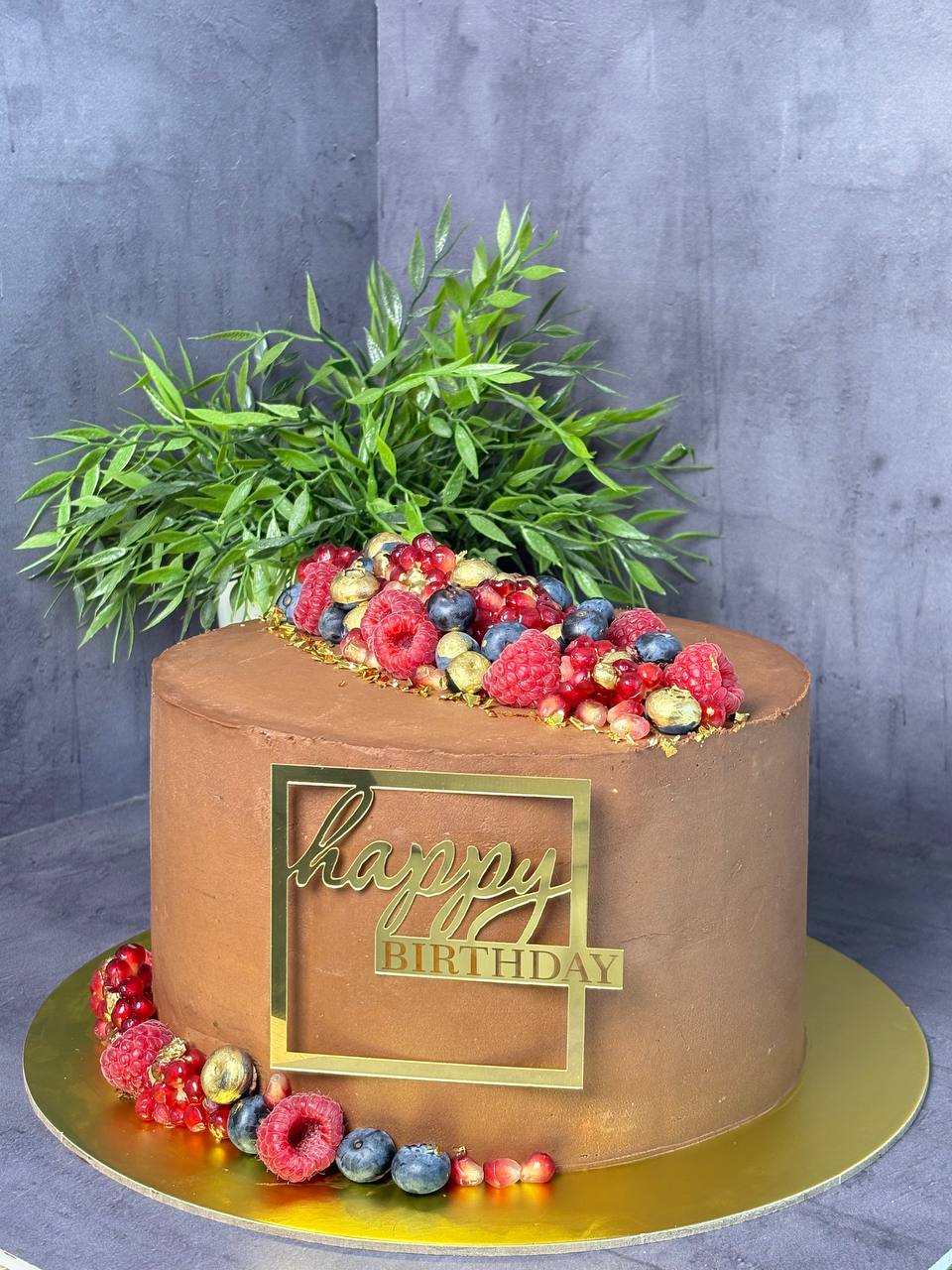 Chocolate birthday cake with fresh berries