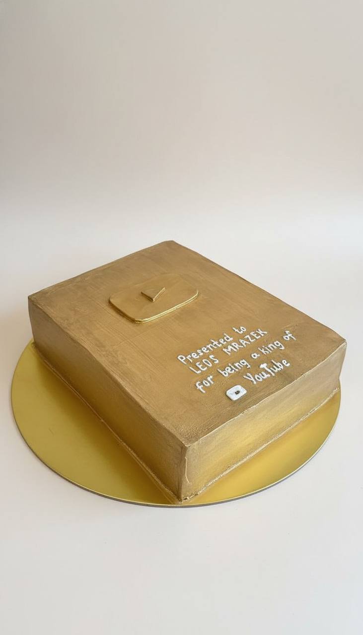 Golden YouTube play button cake for a creator