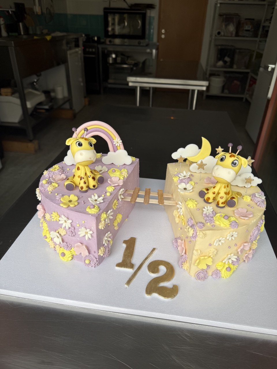 Half birthday giraffe kids cake in pink and yellow