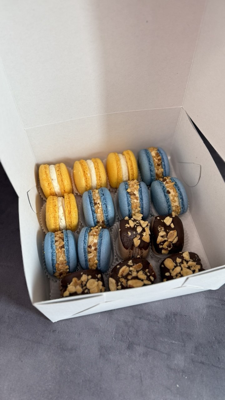 Box of yellow and blue macarons