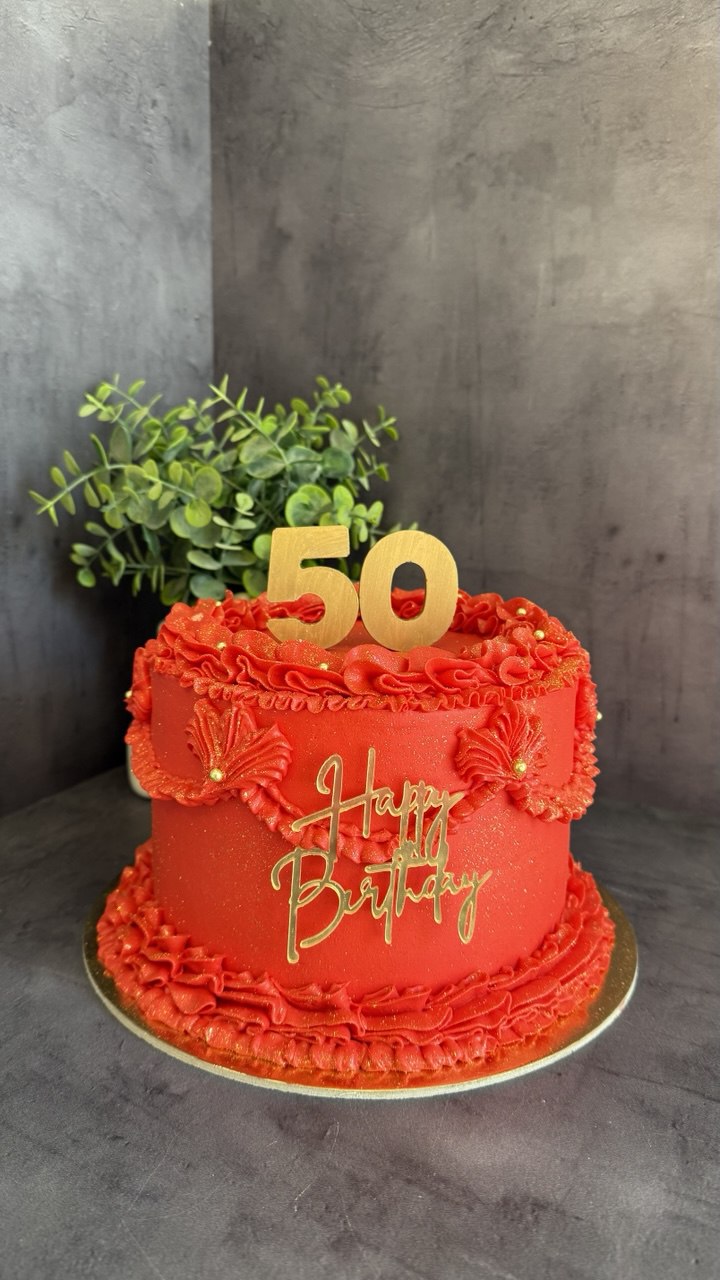 Red ruffle 50th birthday cake with gold topper