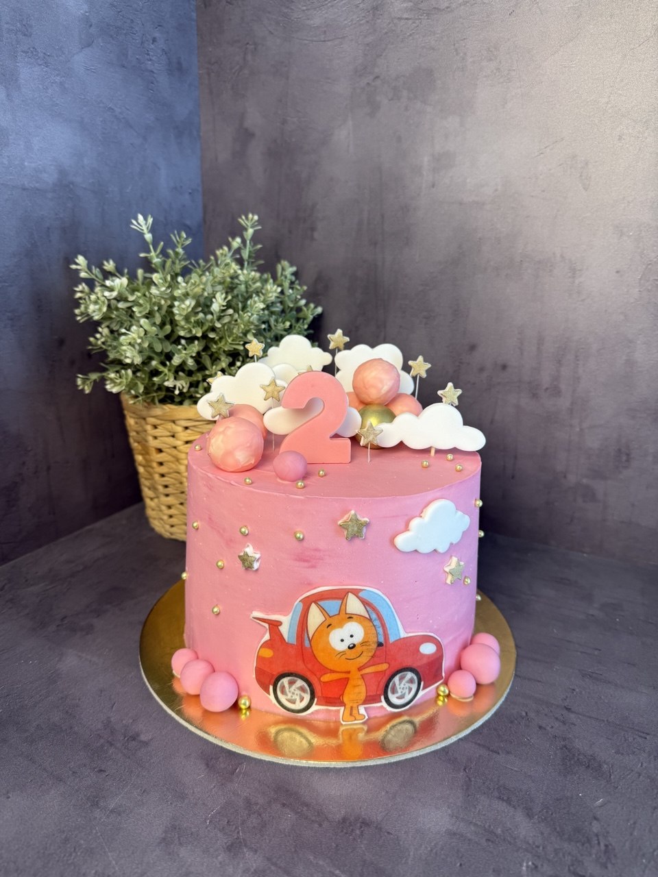 Pink kids cake with cat car for age 2