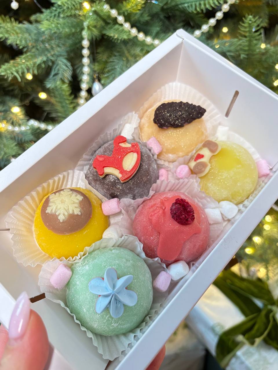 Colorful decorated Christmas mochi in a gift box